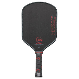 Front view of a black pickleball paddle with red "CORAL PRO" text, a "6.0" graphic, and "SIXZERO" branding.