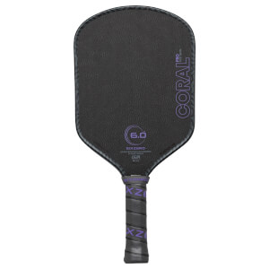 Back view of a black pickleball paddle with a textured surface, "CORAL PRO" and "6.0" visible.