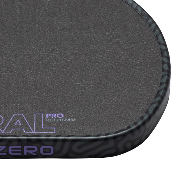 Corner view of a dark grey paddle with purple "PRO RCD 16MM" text and a dark patterned edge.