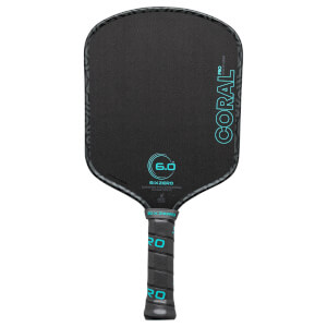 Front view of a black pickleball paddle with "CORAL PRO 6.0" in turquoise text and a textured surface.