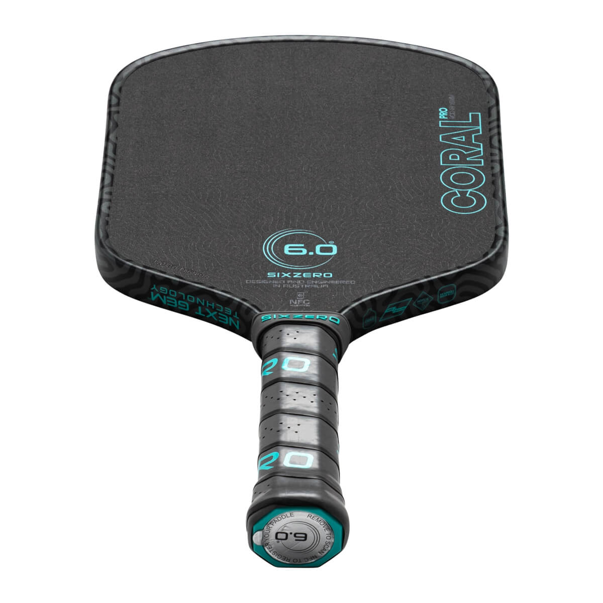 Front view of a black pickleball paddle with "CORAL PRO" and "SIXZERO" logos in teal.
