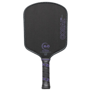 Front view of a black pickleball paddle with purple "CORAL PRO" text and a "6.0" graphic.