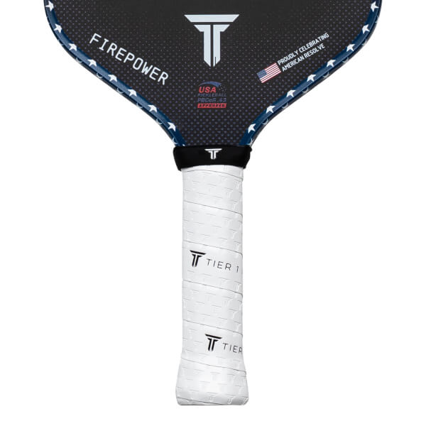 Top-down view of a pickleball paddle with "FIREPOWER" and a USA flag graphic.
