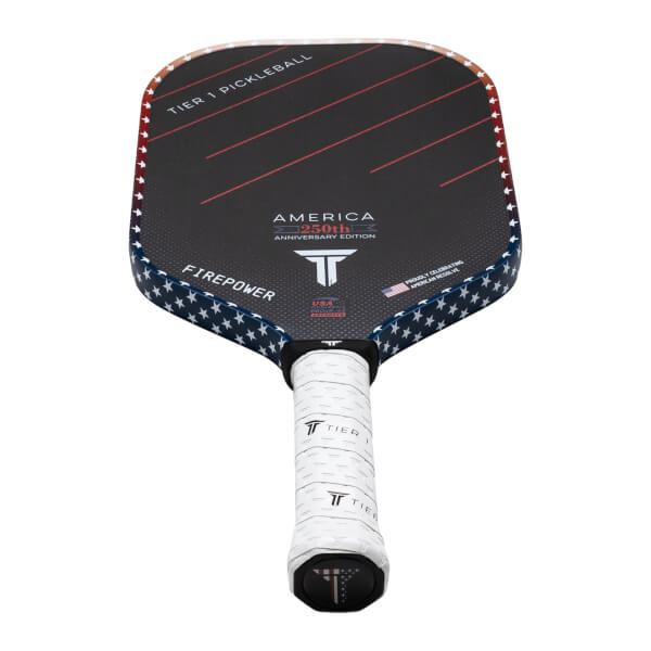 Front view of a pickleball paddle with a black face, red stripes, and a star-spangled border.