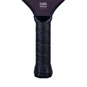 Close-up of a black pickleball paddle grip with USAPA APPROVED text.
