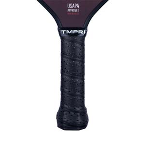 Close-up of a black pickleball paddle grip with perforated texture and TMPR branding.