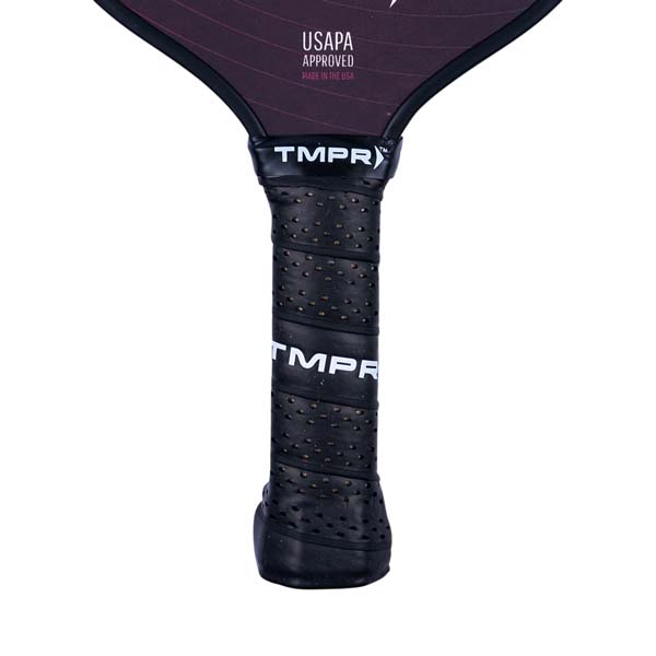 Close-up of a black pickleball paddle grip with TMPR branding and USAPA approved text.