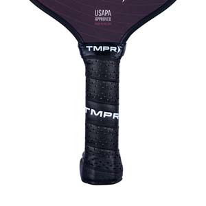 Close-up of a black pickleball paddle grip with TMPR branding and USAPA approved text.