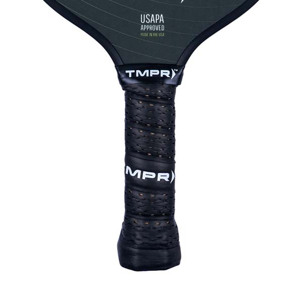Close-up of a black pickleball paddle grip with TMPR and MPR branding and perforated texture.