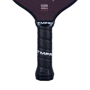 Close-up of a black pickleball paddle grip with perforated texture and TMPR branding.