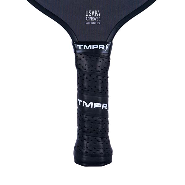 Close-up of a black pickleball paddle grip with TMPR branding and perforated texture.