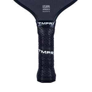 Close-up of a black pickleball paddle grip with TMPR branding and perforated texture.