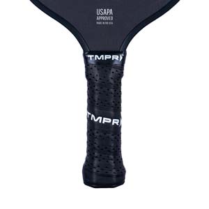 Close-up of a black pickleball paddle grip with perforations and TMPR branding.