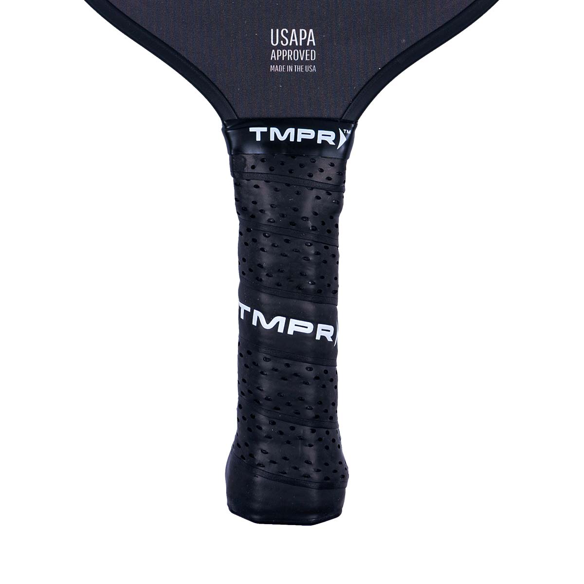 Close-up of a black pickleball paddle grip with perforations and TMPR branding.