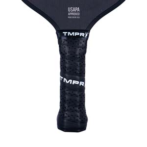 Close-up of a black pickleball paddle grip with perforations and TMPR branding.