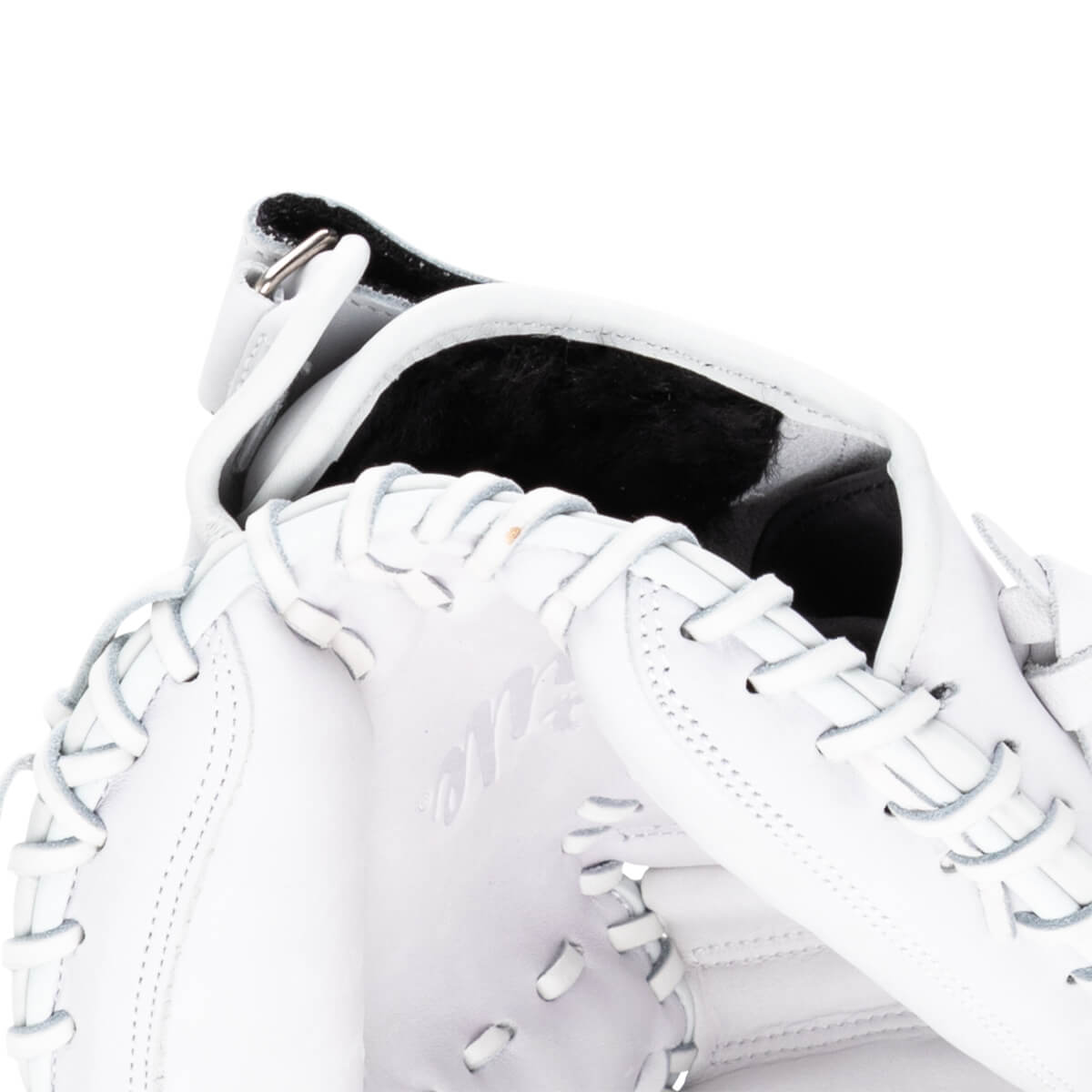 Close-up of a white baseball glove showing the lacing, the interior lining, and embossed text.