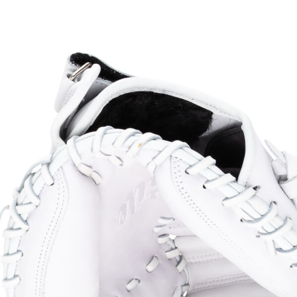 Close-up of a white baseball glove showing the lacing, the interior lining, and embossed text.