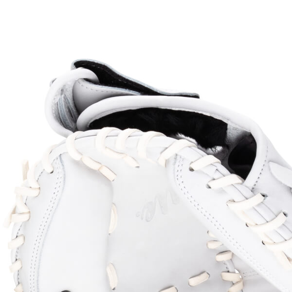 Close-up of a white baseball glove showing the lacing and the "Rawlings" logo.