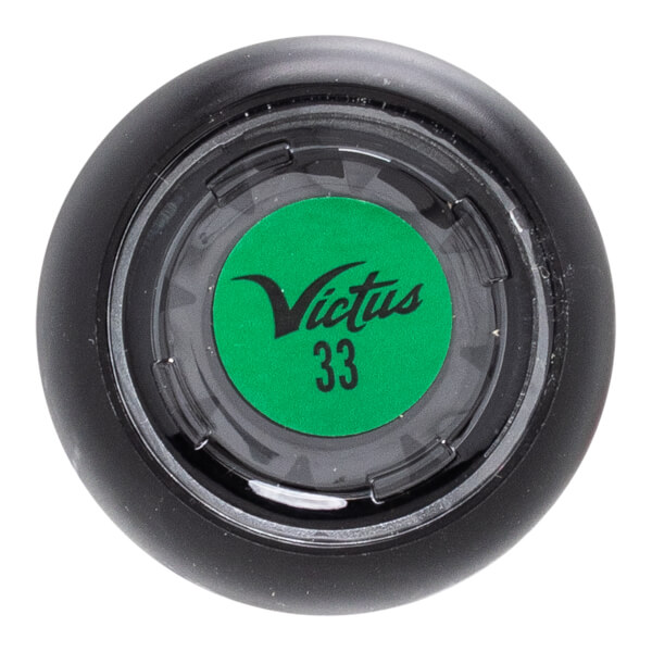 Top-down view of a black baseball bat end cap with a green circular insert featuring the Victus logo and number 33.