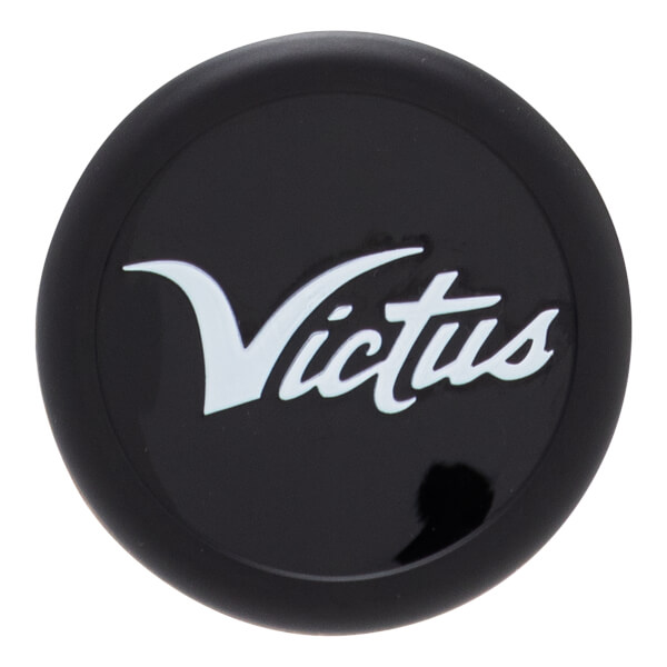 Close-up, top-down view of a black bat end cap with a raised white Victus script logo.