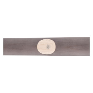 Close-up of a dark gray maple wood baseball bat featuring a light oval ink dot.