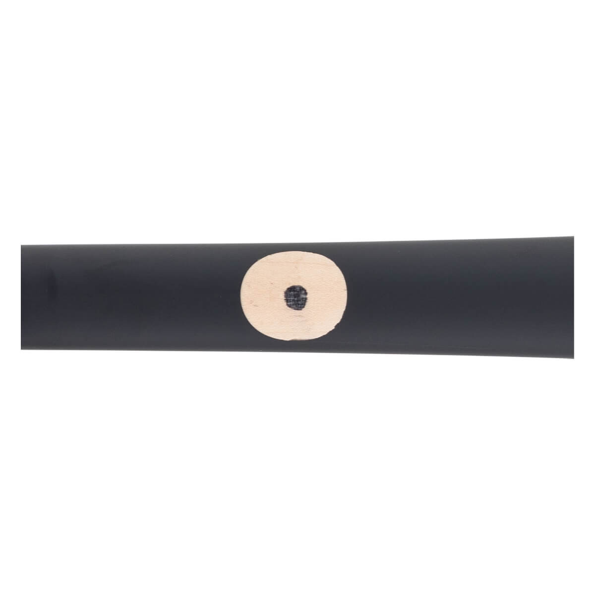Close-up of a black maple wood baseball bat with a light circular ink dot.