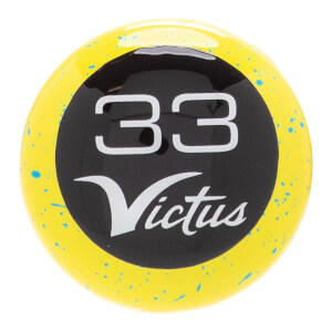 Close-up of a yellow baseball bat knob with blue speckles, a black circular insert, and white 33 and Victus text.