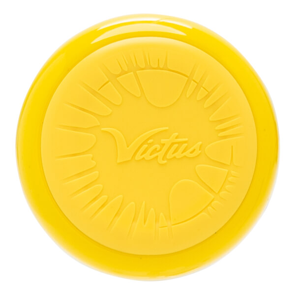 Top-down view of a yellow bat end cap with an embossed Victus logo and stylized sunburst pattern.