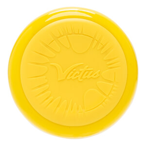 Top-down view of a yellow bat end cap with an embossed Victus logo and stylized sunburst pattern.