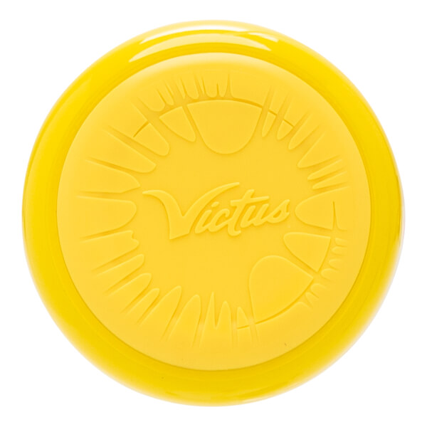 Top-down view of a yellow baseball bat end cap with an embossed Victus logo and textured paw print designs.