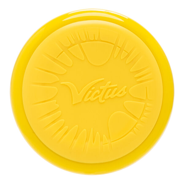 Top-down view of a yellow baseball bat end cap with an embossed Victus logo and claw-like patterns.