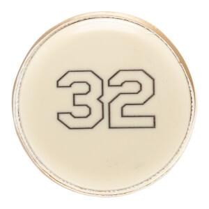 Top-down view of a cream bat end cap with a black outlined number 32 printed centrally.