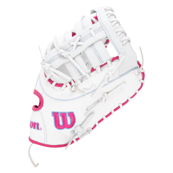 Side view of a white Wilson glove with pink trim and stitching, showing the "W" logo.