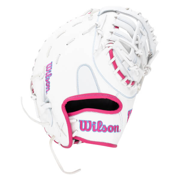 Front view of a white Wilson softball glove with pink trim and blue stitching.