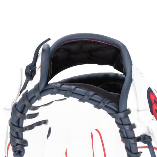 Close-up of a white baseball glove with navy lacing and red stitching.