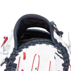 Close-up of the opening of a white baseball glove with navy blue binding and red accents.