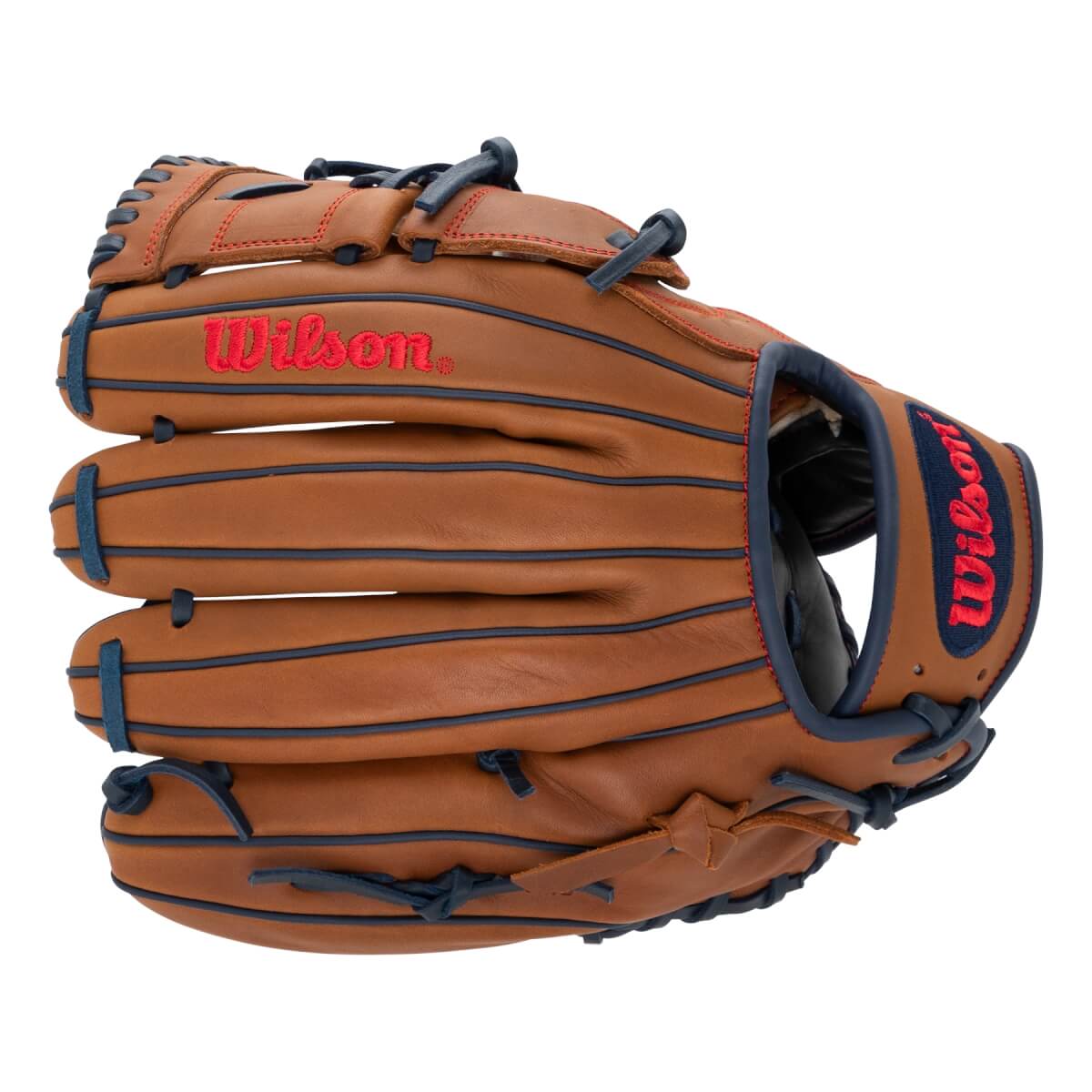 Angled front view of a brown baseball glove with red Wilson logos, navy blue lacing, and red stitching.