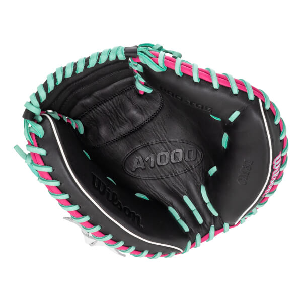 Top-down view of a black catchers mitt with hot pink and mint green lacing, white piping, and A1000 embossed on the palm.