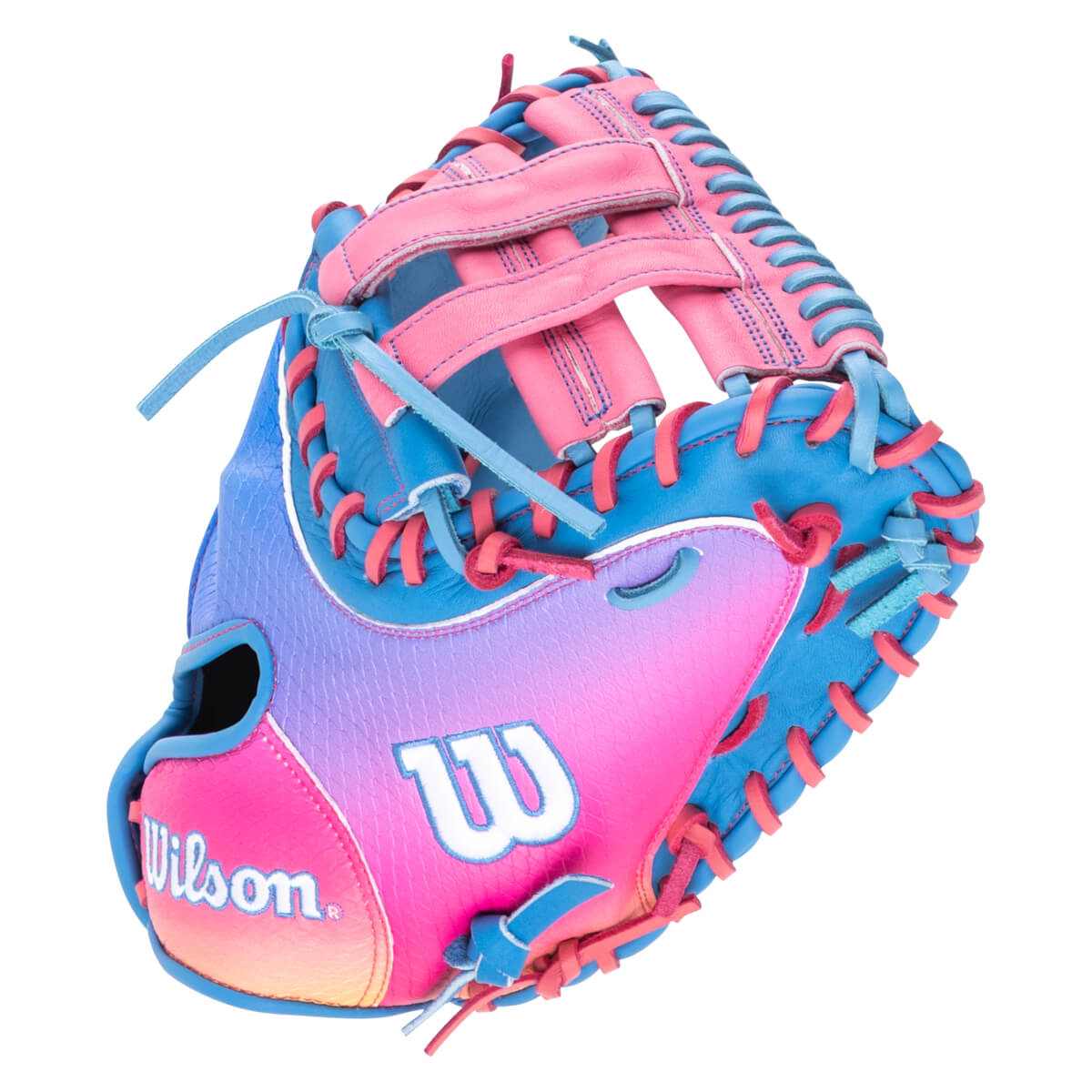 Front view of a pink, blue, and purple gradient baseball glove with "Wilson" and "W" logos.