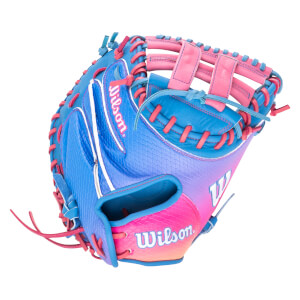 Side view of a blue and pink Wilson baseball glove with red lacing and a gradient design.