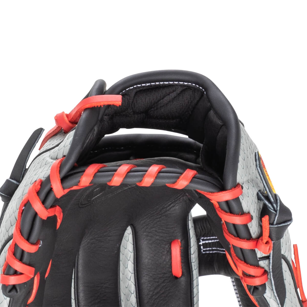 Close-up of a baseball glove showing red lacing, black leather, and a grey textured pattern.