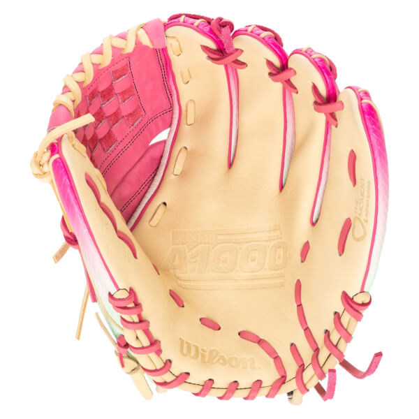 Top-down view of a tan and pink Wilson A1000 baseball glove with "THE MOMENT" text.