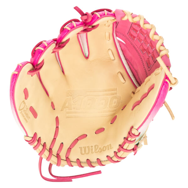Top-down view of a pink and tan Wilson A1000 baseball glove with "Wilson" and "A1000" embossed.