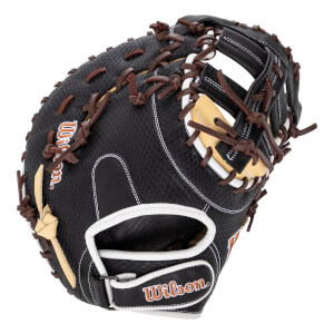 Angled view of a black baseball first base mitt with brown laces, white trim, textured surface, and Wilson logo.