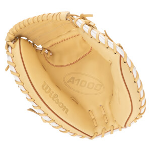 Top-down view of a tan Wilson A1000 baseball glove with white lacing and red stitching.