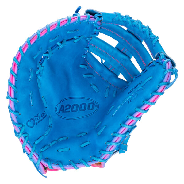 Front view of a blue leather baseball mitt with pink and blue lacing, featuring the A2000 logo in the palm and THE MOMENT autism speaks logo on the side.