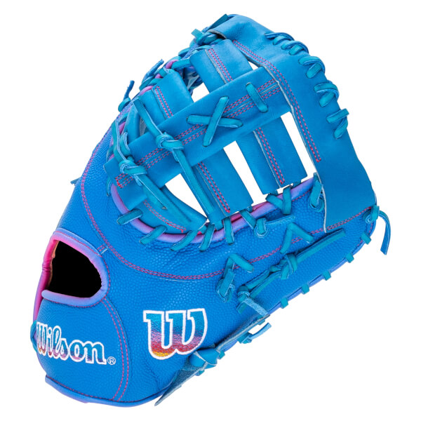 Back view of a bright blue Wilson baseball glove featuring pink stitching and gradient "Wilson" and "W" logos on the shell and wrist strap.