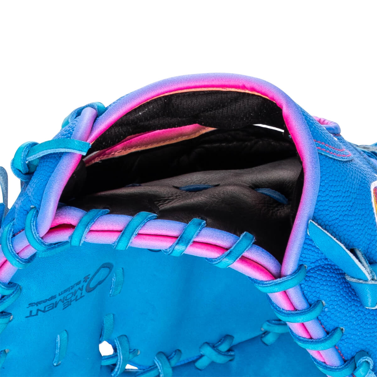 Close-up of the hand opening featuring blue and pink ombre trim, teal laces, and the words "THE MOMENT autism speaks" stamped on the blue palm.