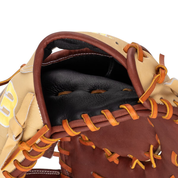 Close-up of a baseball glove showing the tan leather pocket with brown lacing and a black interior.