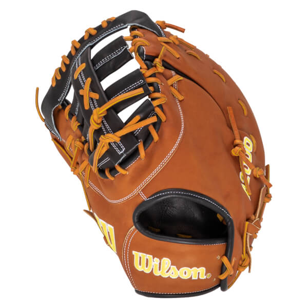 Angled view of a brown baseball glove with orange lacing and "Wilson" text.